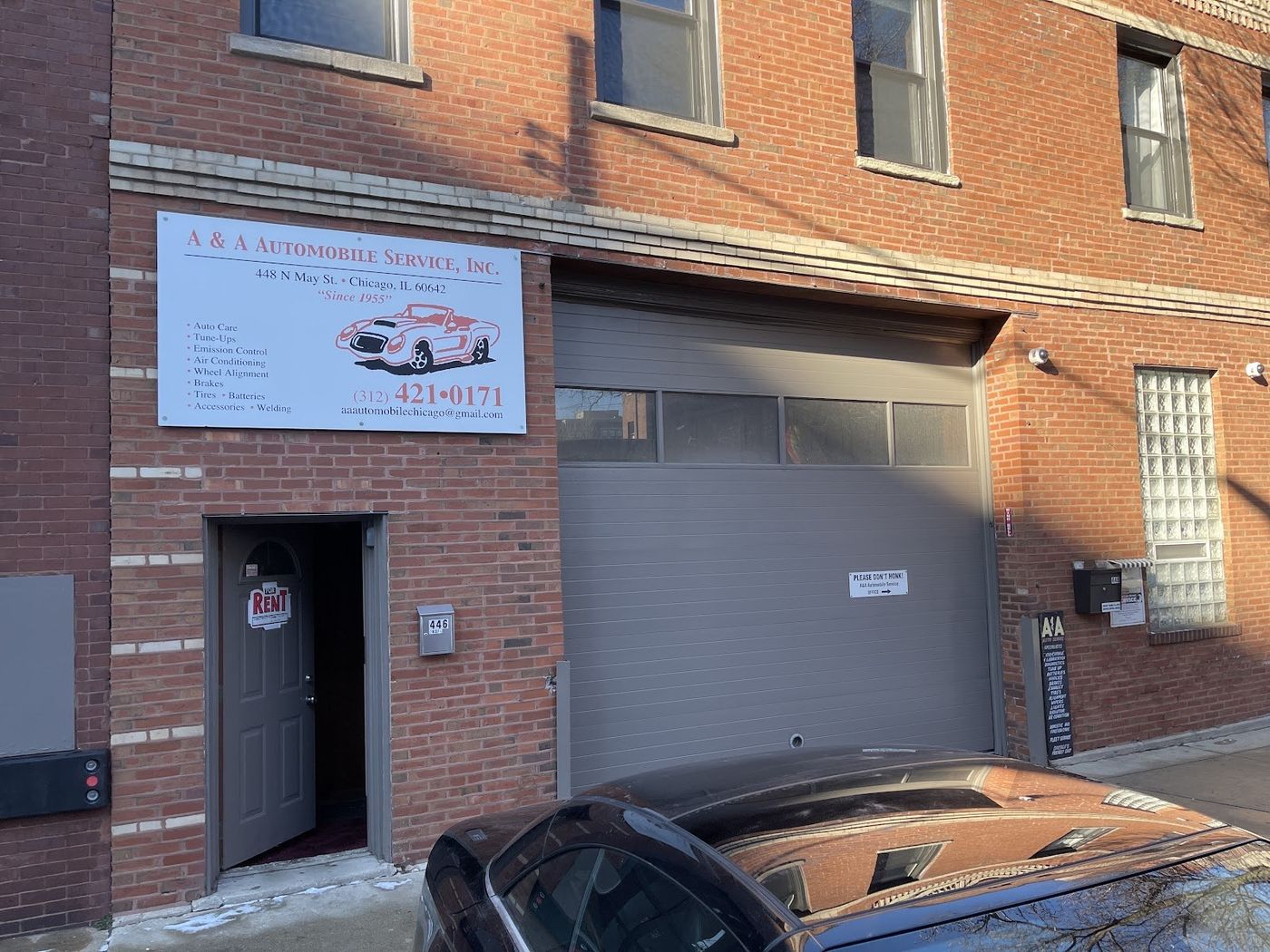 A & A Automobile Service garage door and sign on N May St